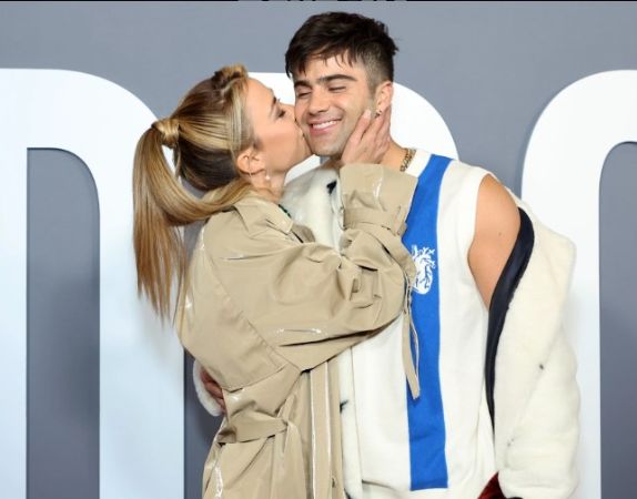 Actress Yamila Saud kissing Max Ehrich on the cheek. 